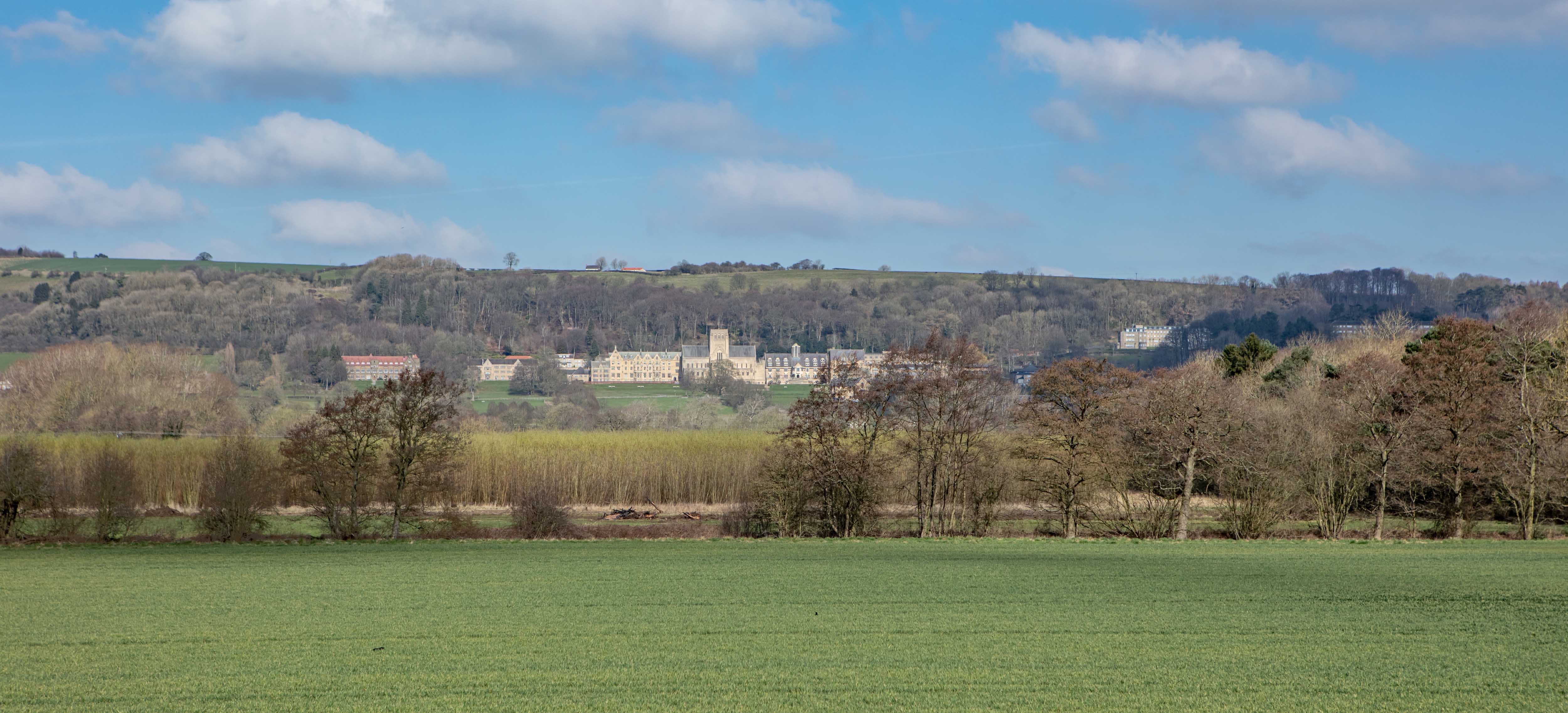 View of Ampleforth Abbey with green fields in the foreground