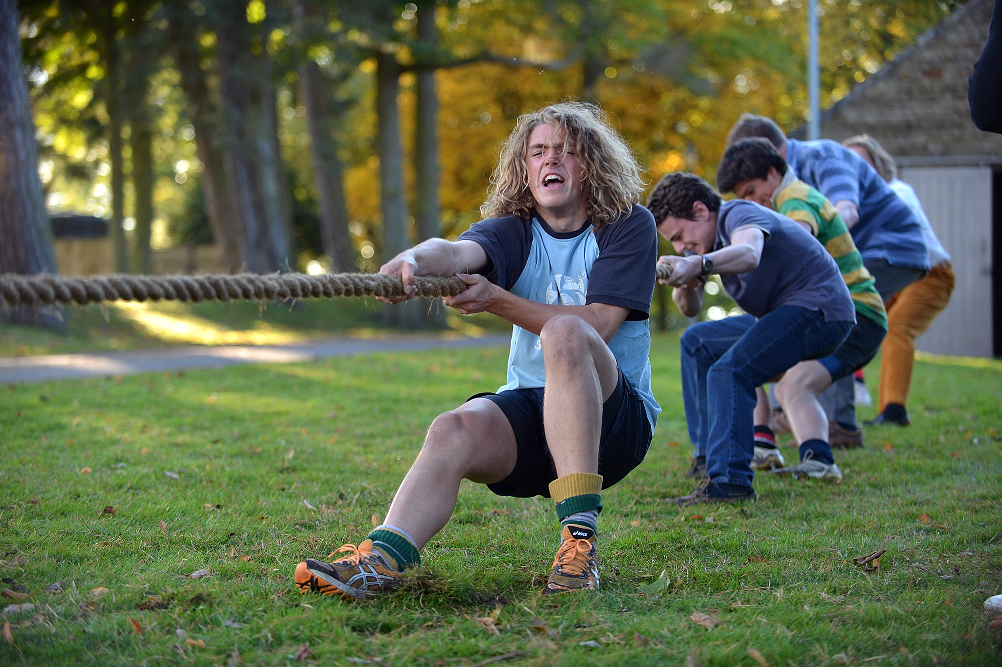 Man taking part in team tug of war