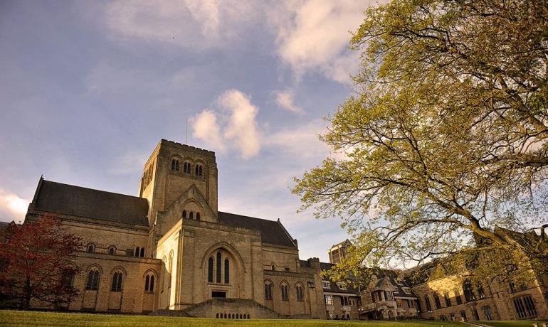 Ampleforth Abbey next to autumn trees