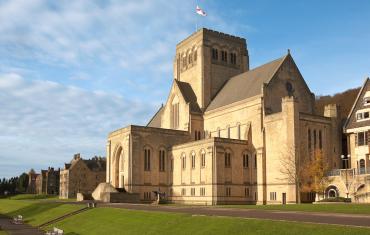 Abbey Church seen from the West on a sunny day with tree